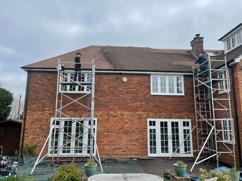 Roof cleaning carried out safely from scaffold towers by The Roof Moss Cleaners in Cheltenham